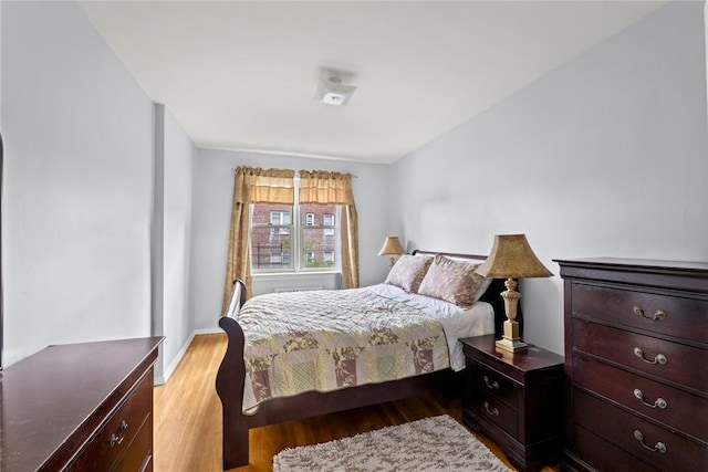 bedroom featuring light wood-type flooring