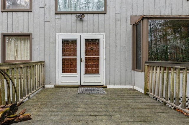 property entrance with french doors and a wooden deck