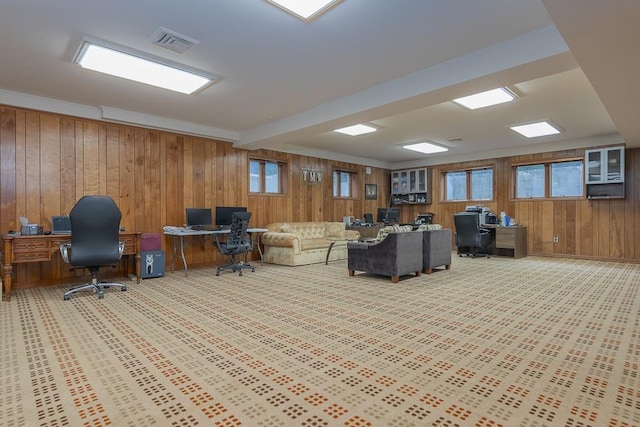 office area with light colored carpet, crown molding, and wooden walls