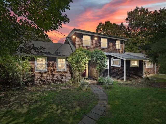 view of front of house with a lawn