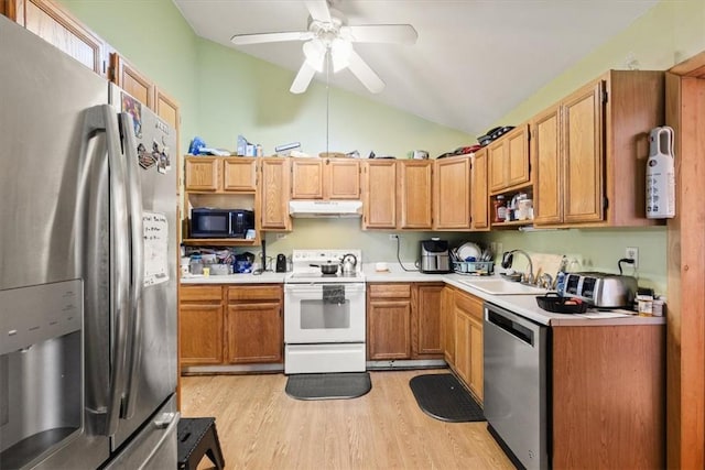 kitchen with lofted ceiling, sink, light hardwood / wood-style flooring, ceiling fan, and appliances with stainless steel finishes