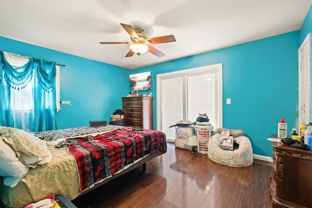 bedroom with hardwood / wood-style flooring and ceiling fan