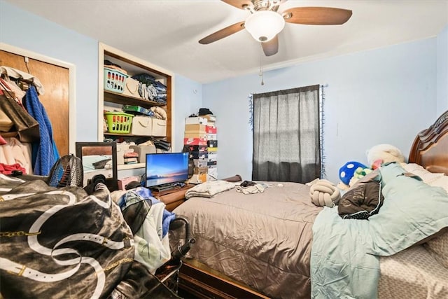 bedroom with ceiling fan and a closet