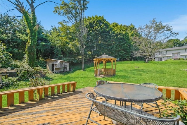 deck featuring a gazebo and a yard