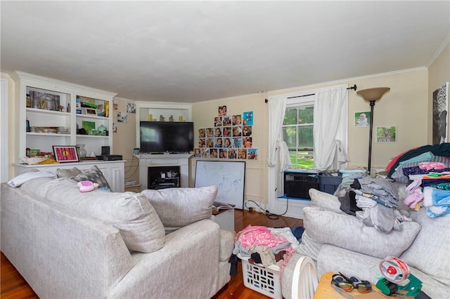 living room featuring dark hardwood / wood-style floors, cooling unit, and crown molding