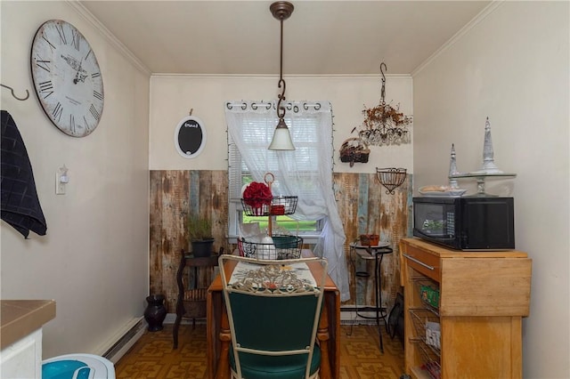 dining room featuring parquet flooring, a baseboard radiator, and crown molding