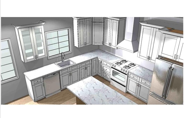 kitchen with gray cabinets, sink, stainless steel appliances, and wall chimney range hood