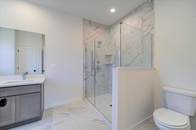 bathroom with a shower with door, vanity, and toilet