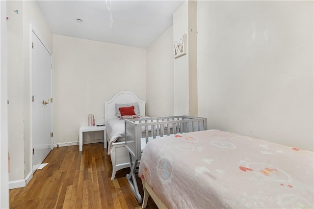 bedroom featuring wood-type flooring