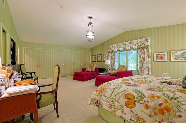 bedroom featuring light colored carpet and vaulted ceiling