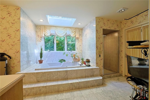 bathroom with separate shower and tub