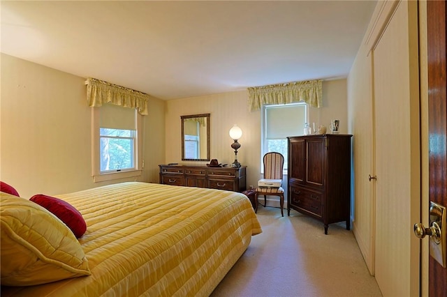 bedroom with light colored carpet