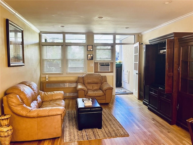 living room with cooling unit, light hardwood / wood-style floors, and ornamental molding