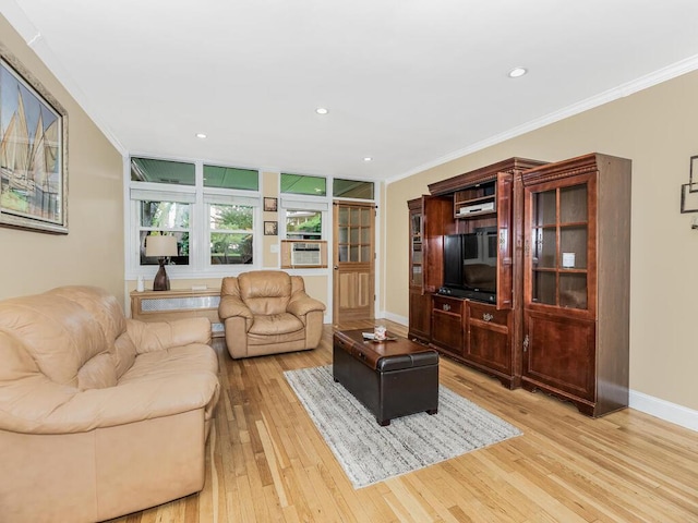 living room featuring light hardwood / wood-style floors, crown molding, and cooling unit