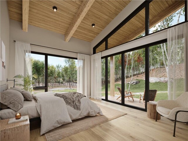 bedroom featuring beam ceiling, light hardwood / wood-style floors, and multiple windows