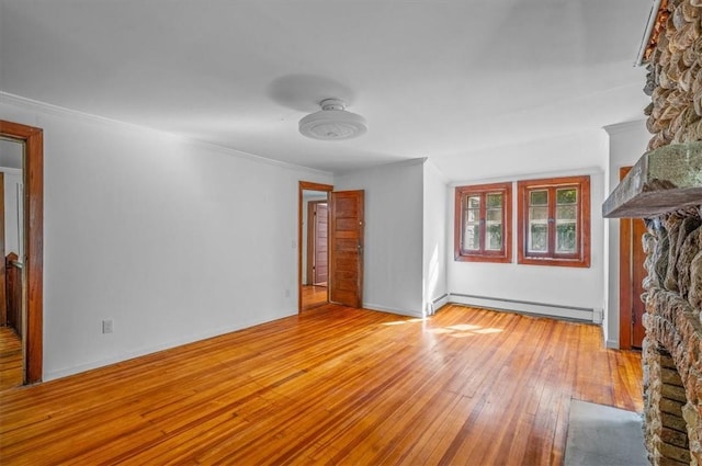 unfurnished living room with a baseboard radiator, a stone fireplace, light hardwood / wood-style floors, and crown molding