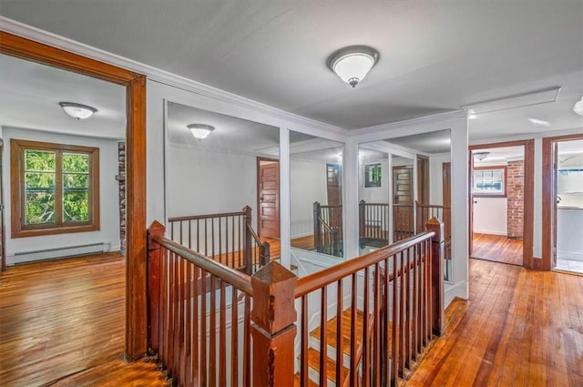 corridor featuring hardwood / wood-style flooring and baseboard heating