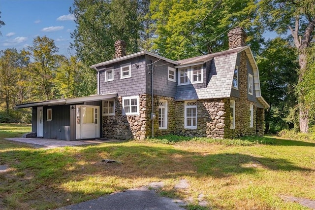 view of front of home with a front yard