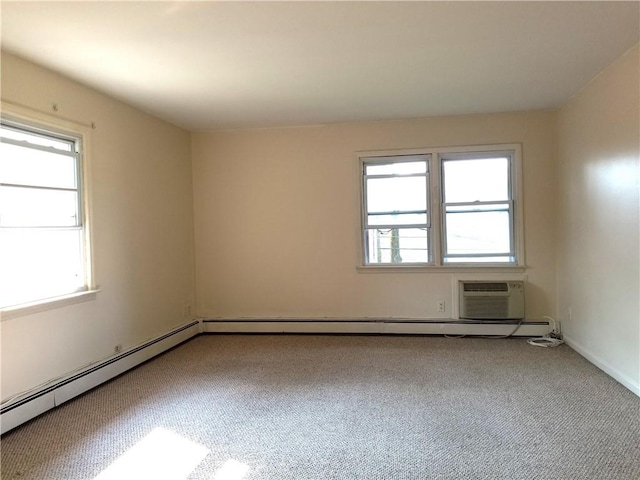 carpeted empty room featuring a wall mounted air conditioner and a baseboard radiator