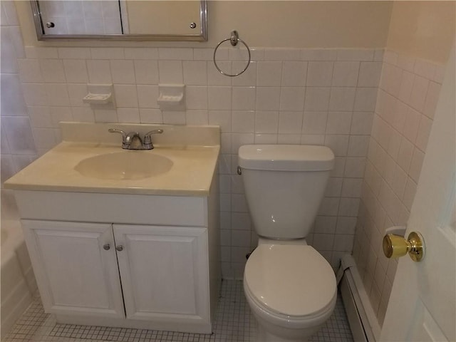 bathroom featuring tile patterned flooring and tile walls