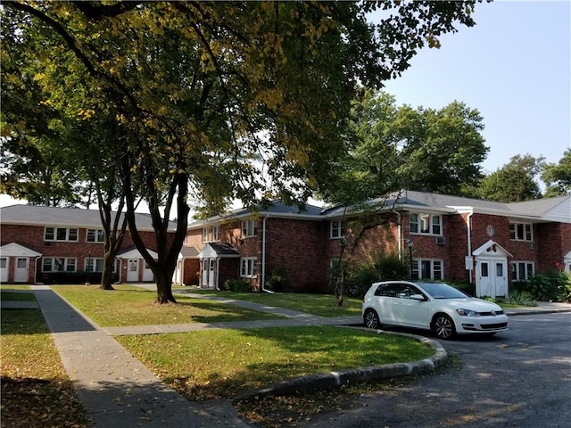 view of property with a front lawn