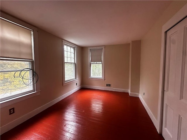 spare room featuring hardwood / wood-style flooring