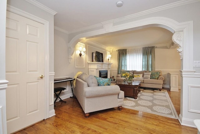 living room featuring crown molding and hardwood / wood-style flooring