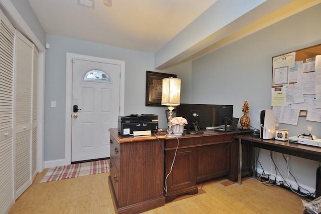 office area with light wood-type flooring