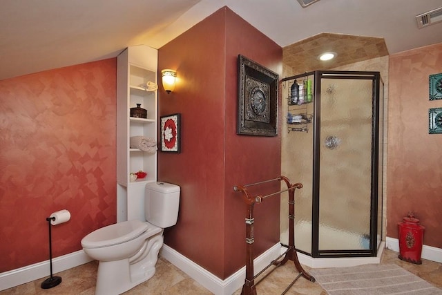 bathroom with a shower with door, tile patterned flooring, and toilet