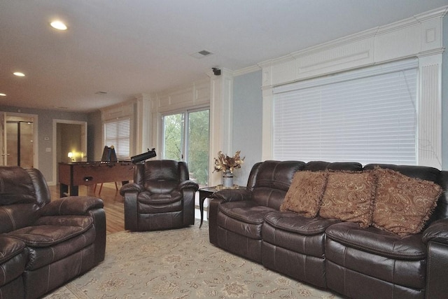 living room with ornamental molding