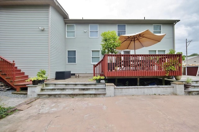 rear view of property with a deck