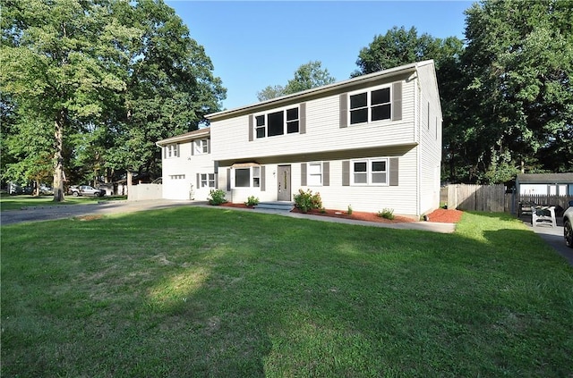 colonial house featuring a front lawn