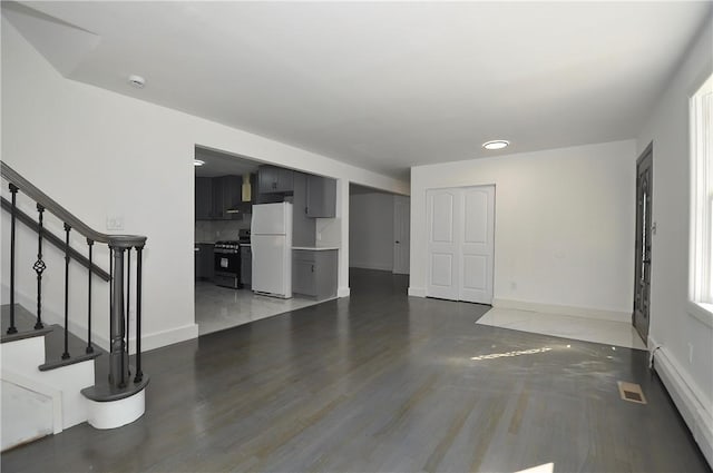 unfurnished living room featuring dark hardwood / wood-style flooring