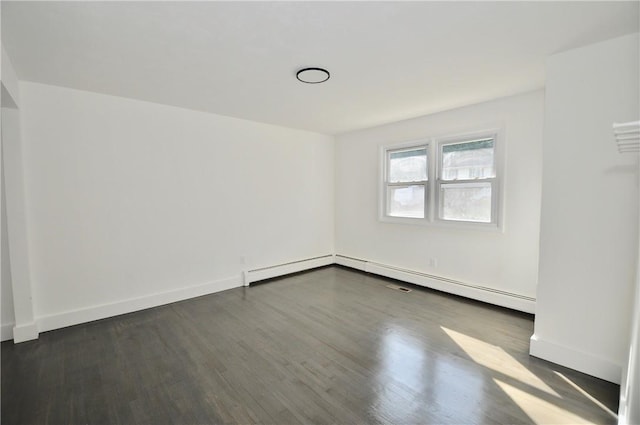 spare room with dark wood-type flooring