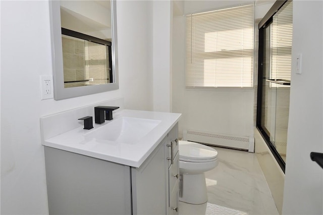 bathroom featuring vanity, toilet, and a baseboard radiator