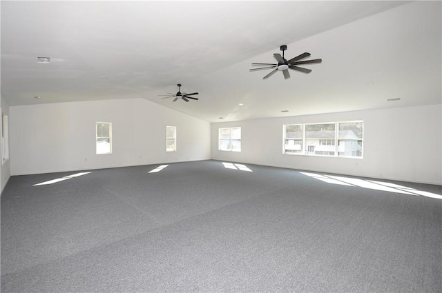 spare room featuring carpet floors, ceiling fan, and lofted ceiling