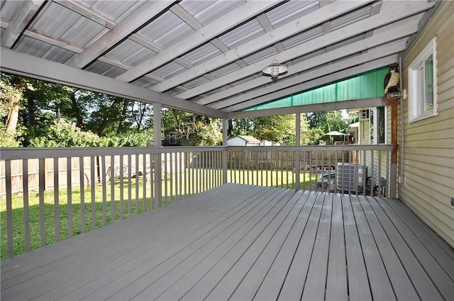 wooden terrace with a lawn