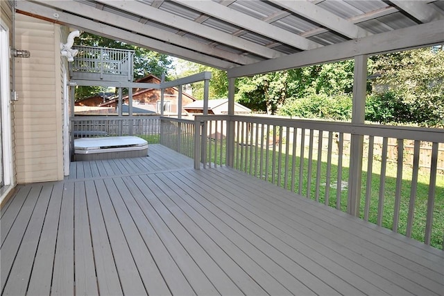 wooden terrace with a lawn