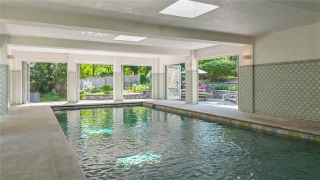 view of pool with a skylight