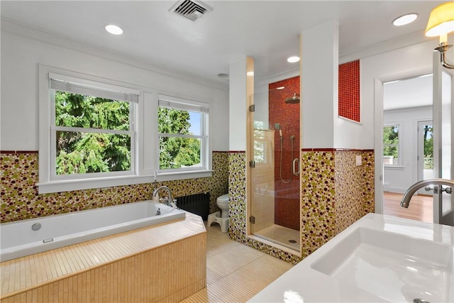 full bathroom featuring sink, tile patterned flooring, toilet, independent shower and bath, and ornamental molding