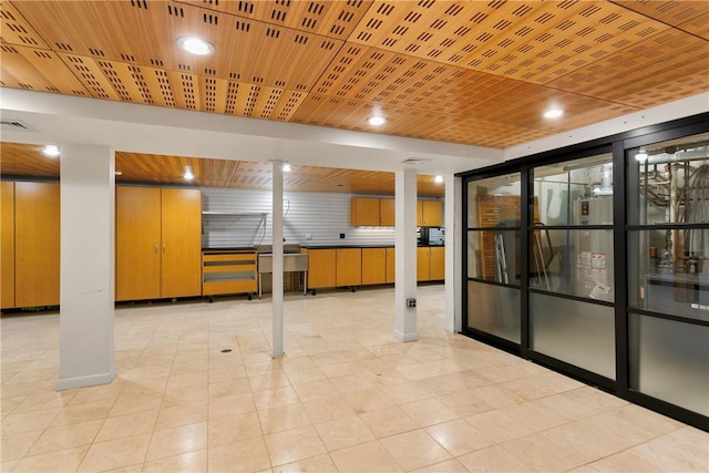 basement with light tile patterned floors and wood ceiling