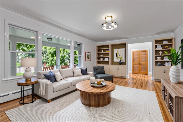living room featuring a baseboard radiator, french doors, light wood finished floors, and built in shelves