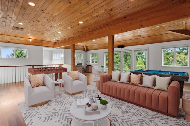 living area with a healthy amount of sunlight, wooden ceiling, and light wood finished floors