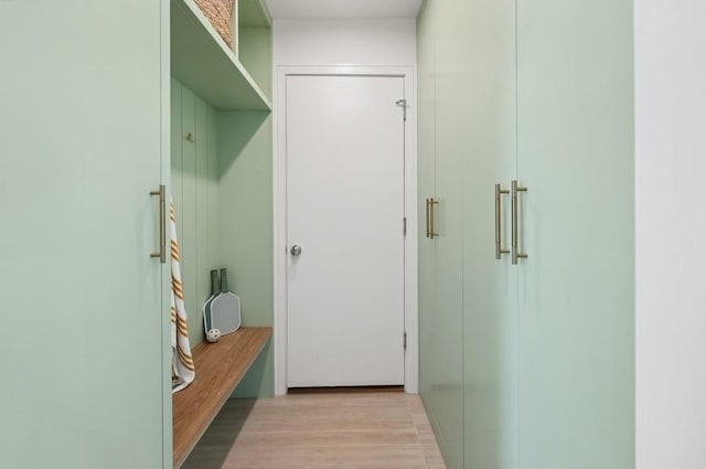 mudroom with light hardwood / wood-style floors