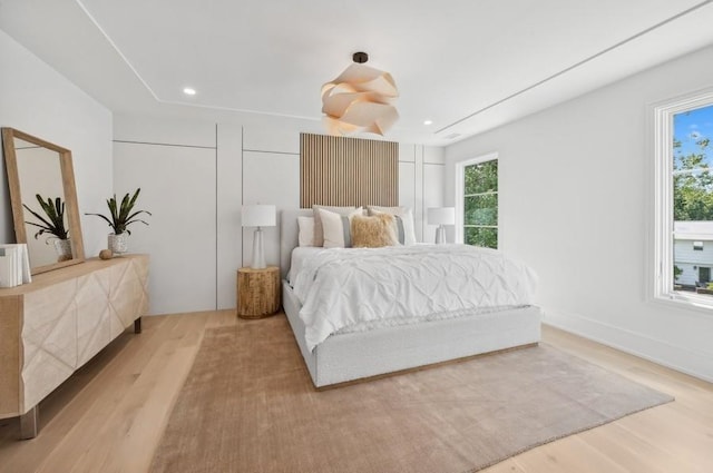 bedroom with light wood-type flooring