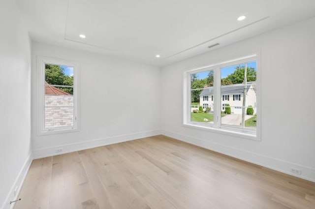 unfurnished room featuring light hardwood / wood-style floors