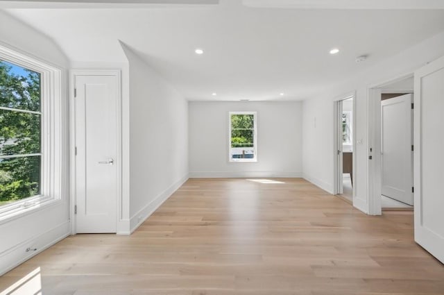 unfurnished room with light wood-type flooring