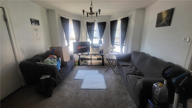 living room featuring carpet flooring and a chandelier