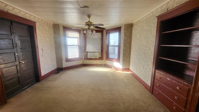 interior space featuring wallpapered walls, baseboards, ceiling fan, carpet flooring, and a textured wall