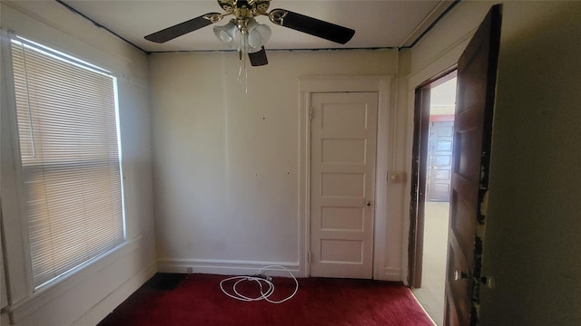 spare room featuring a wealth of natural light and baseboards